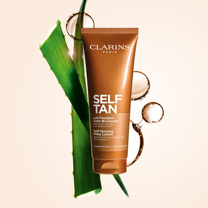Foto del producto Body Self-Tan Milk de Clarins con aloe, mol&eacute;culas de DHA y eritrulosa, destacando sus dos ingredientes bronceadores clave.