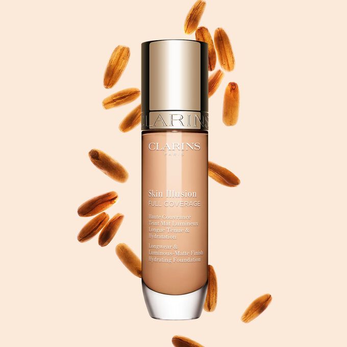 Clarins Skin Illusion Full Coverage muestra su elegante dise&ntilde;o y su atractivo envase, la base de maquillaje ideal para una tez impecable y natural.