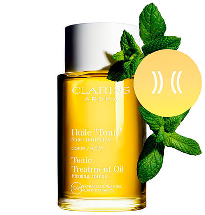 Foto del envase de Aceite 'Tonic' con el principal ingrediente al lado, los extractos de menta silvestre